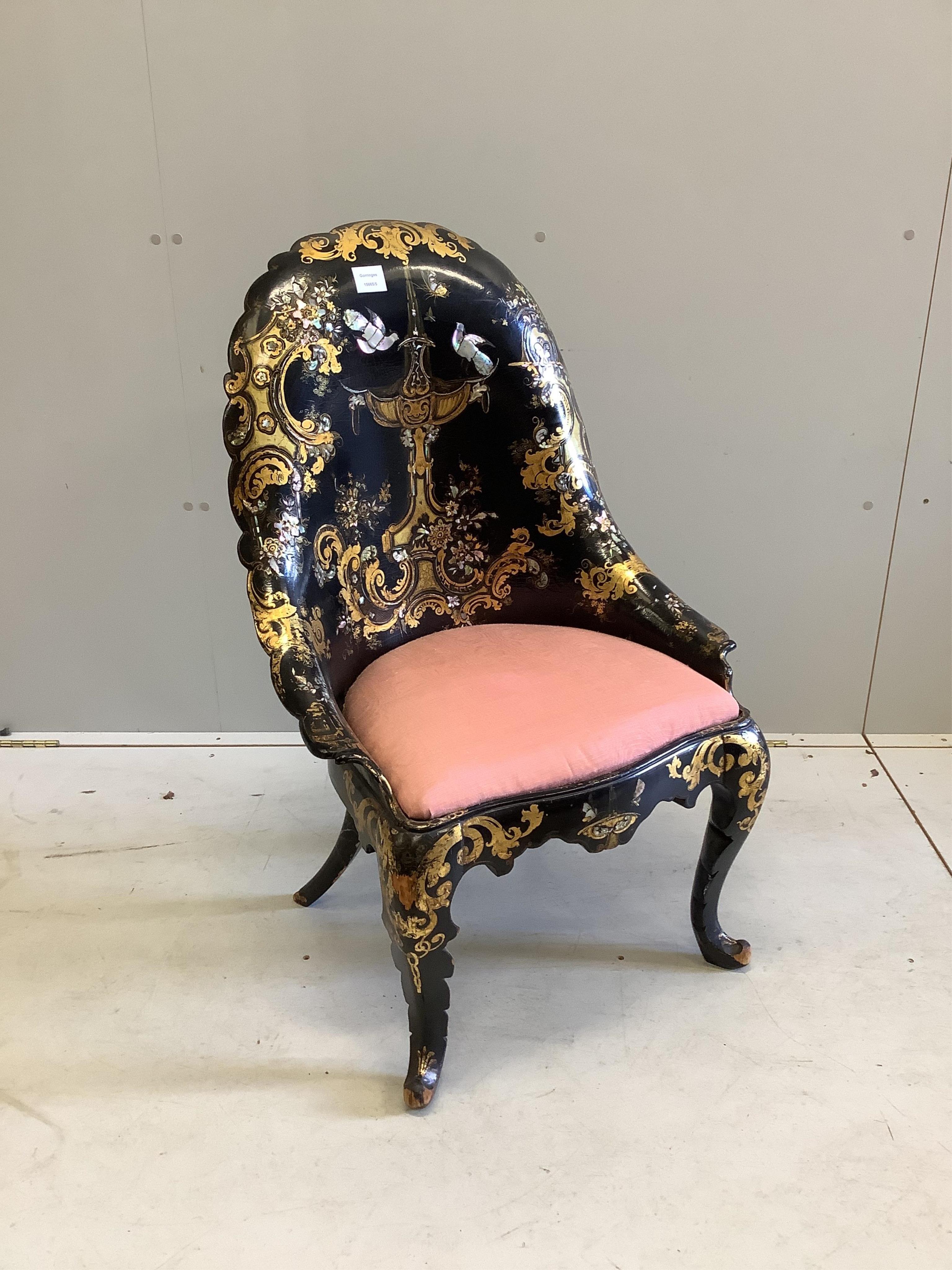 A Victorian papier mache salon chair, with mother of pearl inlay and registration number on the back, width 60cm, height 95cm. Condition - small areas of wear but essentially good condition